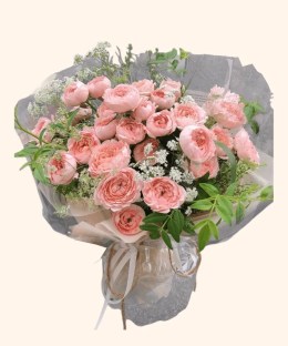 Full abundant apricot garden roses, white lace flower, fresh green foliage, and translucent ivory wrapping