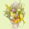 Full yellow garden roses, orange spray roses, purple stock, pink freesia, oncidium, blue tweedia, and pale delphinium