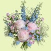 Full blush pink peonies with blue delphinium, pink campanula, baby's breath, and fountain grass