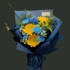 Full three yellow sunflowers with dyed blue carnations, deep-blue delphinium, pale-blue flowers, yellow accents, and airy grass