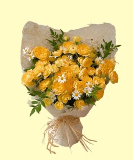 Full cream-yellow spray roses, white chamomile daisies and fresh green foliage in textured ivory wrapping