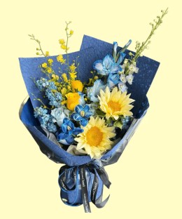 Full cream-yellow sunflowers, blue-white gladiolus, blue and yellow roses, blue delphinium and yellow oncidium