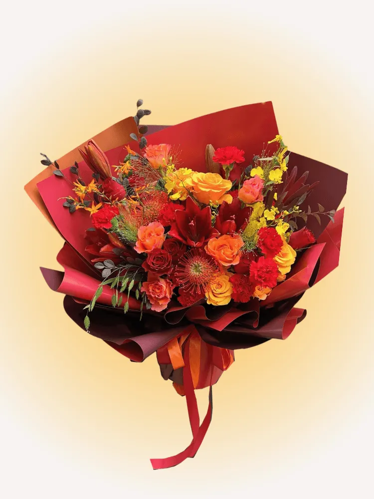 Crimson Celebration Grande Bouquet with red lilies, red roses, and orange pincushion protea