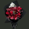 Full burgundy lilies and red roses with white gladiolus, silver dusty miller, pink round accents, and black wrapping