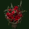 Crimson roses with airy branches, pale accents, and dark textured foliage