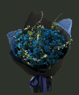 Full a dense bouquet of dyed deep-blue Australian waxflower with delicate white flowering branches and black wrapping