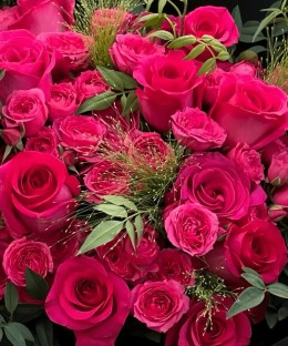 Close-up of fuchsia Floyd-style roses and matching spray roses in the Fuchsia Rose Noir Bouquet