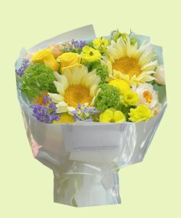 Full cream sunflowers, yellow and champagne garden roses, green hydrangea, ranunculus, purple delphinium, and craspedia