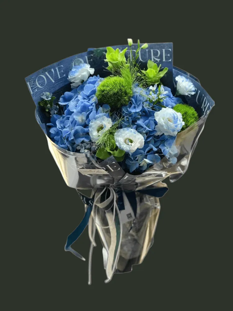 Full blue hydrangea and dyed lisianthus with Green Trick dianthus, green anthurium, blue star flowers, and airy grass