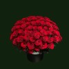 Grand red rose basket arrangement filled with fresh red roses in a classic black hatbox-style container.