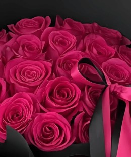 Close-up of red and hot pink rose blooms in the mixed bouquet.
