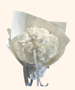 Full fully opened white peonies with ivory wrapping, satin ribbon, and a pearl detail