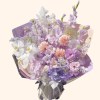 Full peach dahlias, lavender gladiolus, hydrangea, white phalaenopsis, pale anthurium, and purple scabiosa