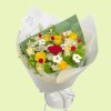 Full red yellow and cream roses, Green Trick dianthus, white ranunculus, meadow flowers, and a Little Prince figure