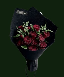 Midnight burgundy roses with variegated leaves in black textured wrapping