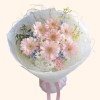 Full blush gerbera, chamomile daisies, blue star flowers, pink carnations, white lisianthus, and misty grass
