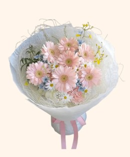 Full blush gerbera, chamomile daisies, blue star flowers, pink carnations, white lisianthus, and misty grass
