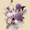 Full giant purple allium with black and blush calla lilies, pale orchids, dusty roses, lisianthus, and misty grass