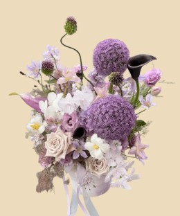 Full giant purple allium with black and blush calla lilies, pale orchids, dusty roses, lisianthus, and misty grass