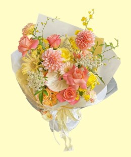 Full peach dahlias and roses, blush anthurium, pale-yellow gerbera, oncidium, lisianthus and white lace flower