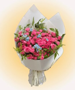 Peach Sky Spray Rose Bouquet with peach-pink spray roses and pale blue star flowers