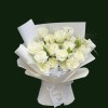 Pure white Mondial-style roses arranged in layered white wrapping