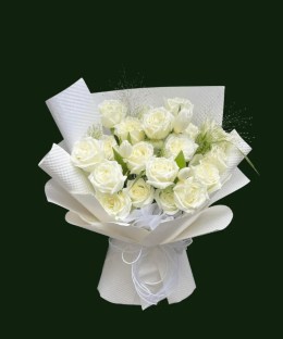 Pure white Mondial-style roses arranged in layered white wrapping