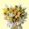 Full sunflowers, white phalaenopsis orchids, cream calla lilies, yellow and ivory roses, green hydrangea and blue accents