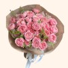 Full abundant dusty-pink garden roses with apricot centres, fine foliage, and taupe wrapping