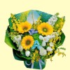 Full yellow sunflowers, white anthurium, blue-white tulips, green hydrangea, white delphinium and yellow oncidium