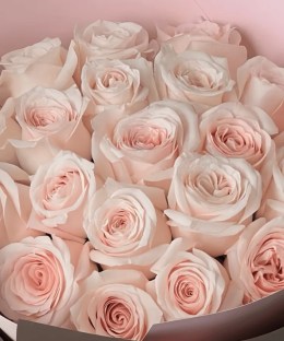 Close-up of soft blush pink rose blooms in the Sweet Beat bouquet.