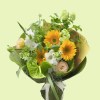 Full sunflowers, green anthurium, white gladiolus, and soft seasonal flowers in a green-and-yellow bouquet