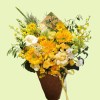 Full standard and Teddy Bear sunflowers with cream roses, oncidium orchids, snapdragons, green hydrangea, and white Ammi
