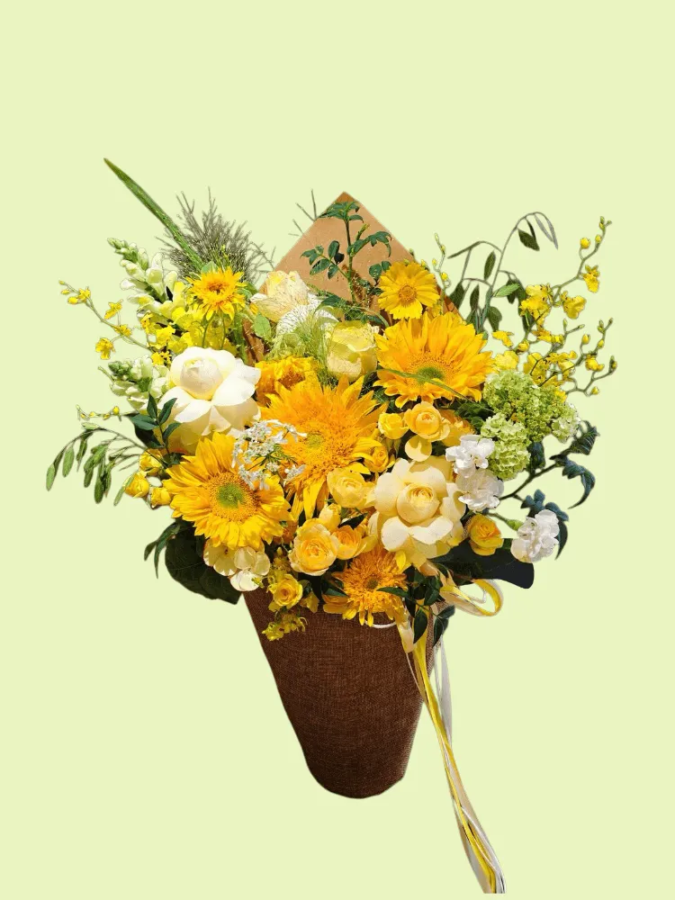Full standard and Teddy Bear sunflowers with cream roses, oncidium orchids, snapdragons, green hydrangea, and white Ammi