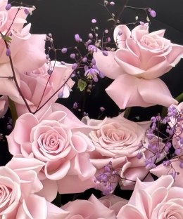 Close-up of pale pink roses and delicate filler flowers in the Sweet Yoga bouquet