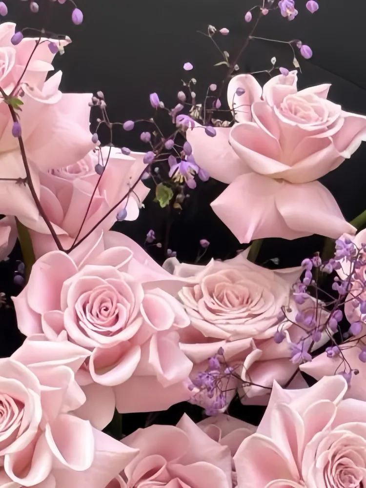 Close-up of pale pink roses and delicate filler flowers in the Sweet Yoga bouquet