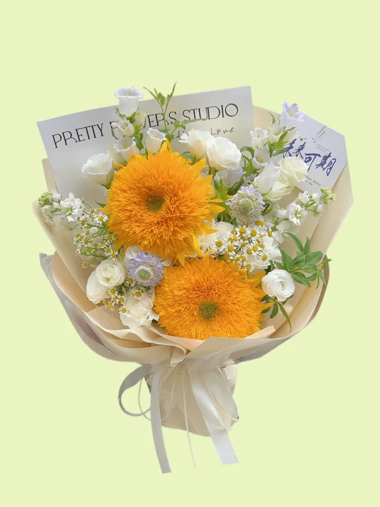 Full two Teddy Bear sunflowers with white lisianthus, campanula, chamomile, purple scabiosa, and eucalyptus