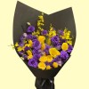 Full deep-purple lisianthus and roses, yellow roses, tulips, calla lilies and oncidium in black wrapping