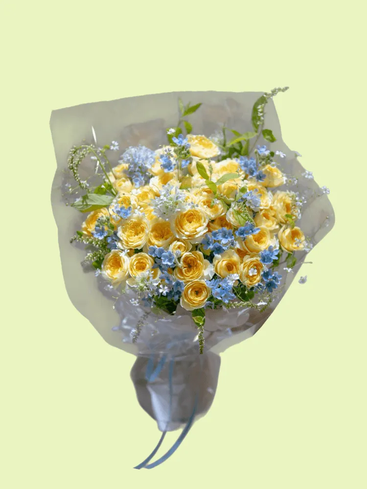 Full yellow garden roses with blue tweedia, pale-blue delphinium, white Queen Anne's lace, and fresh greenery