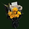 Golden yellow roses with dark botanical accents in black and cream wrapping.