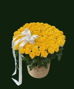 Large yellow rose basket arrangement with fresh yellow roses, green foliage, and a white ribbon.