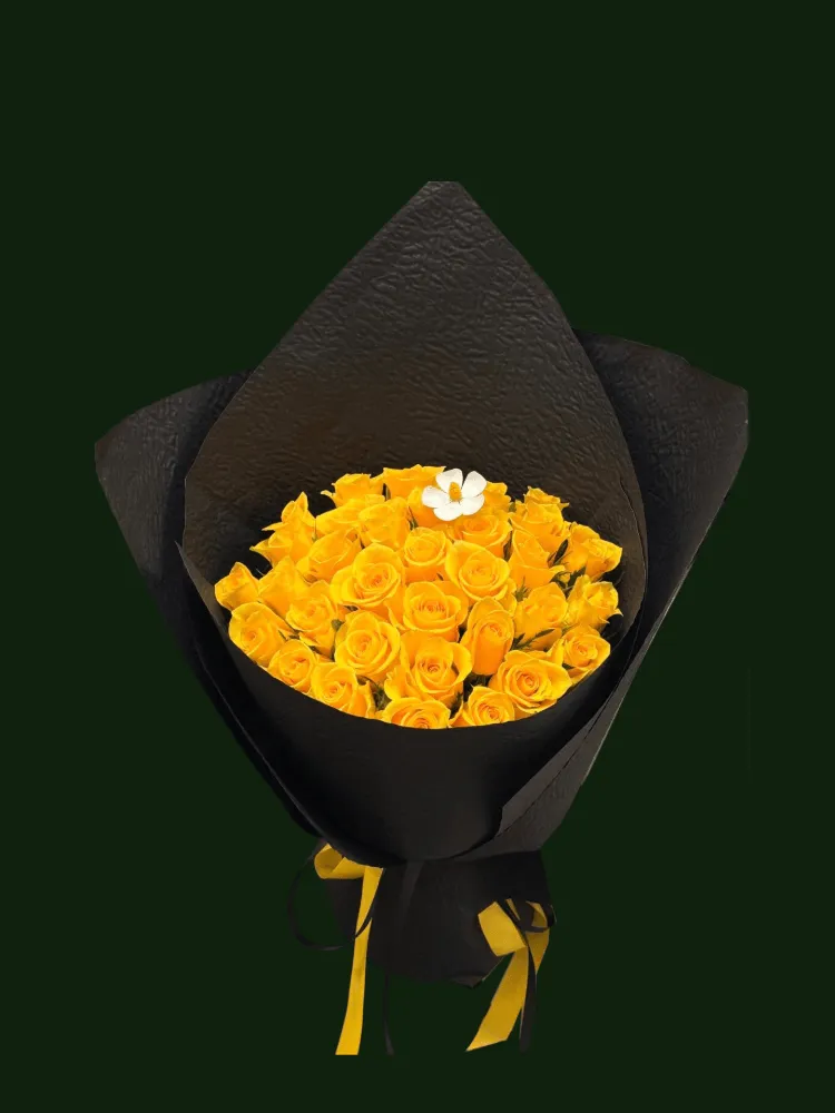 Lush yellow roses with light floral accents in dramatic black wrapping.