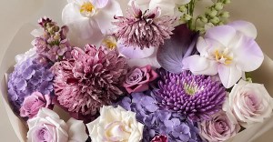 Lavender Couture Orchid and Dahlia flower arrangement in purple and white